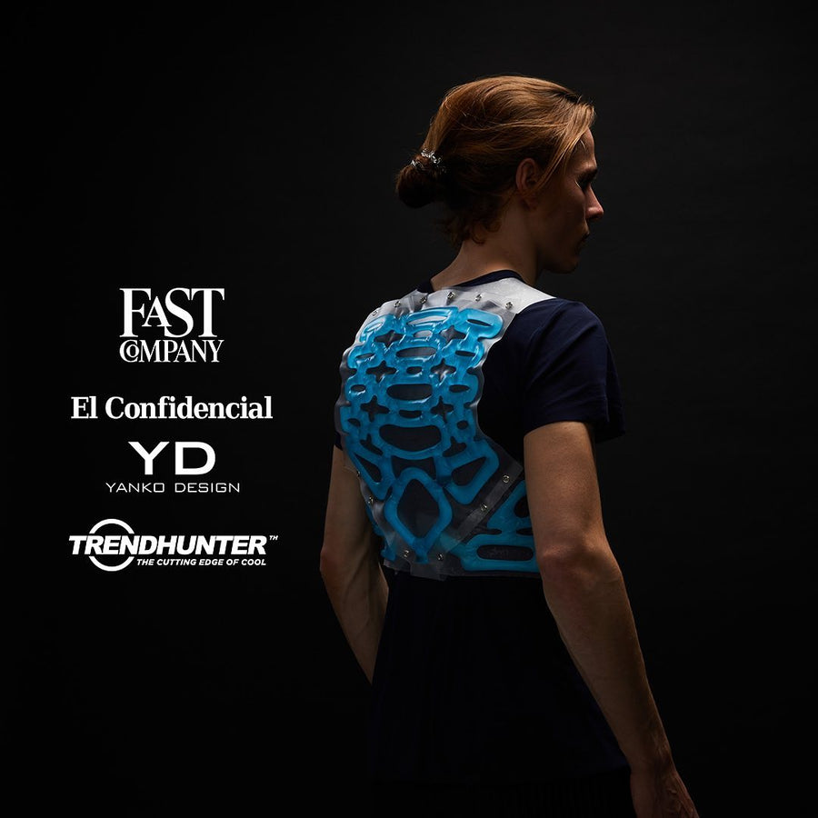 Back view of person wearing Petit Pli’s Entropy Vest, featured by global design media for its innovative, non-electronic thermal technology.