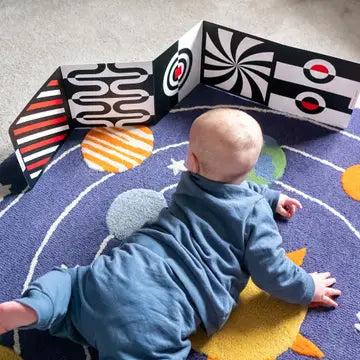 Tiny Human enjoying High-contrast Sensory Flashcards for Tummy Time