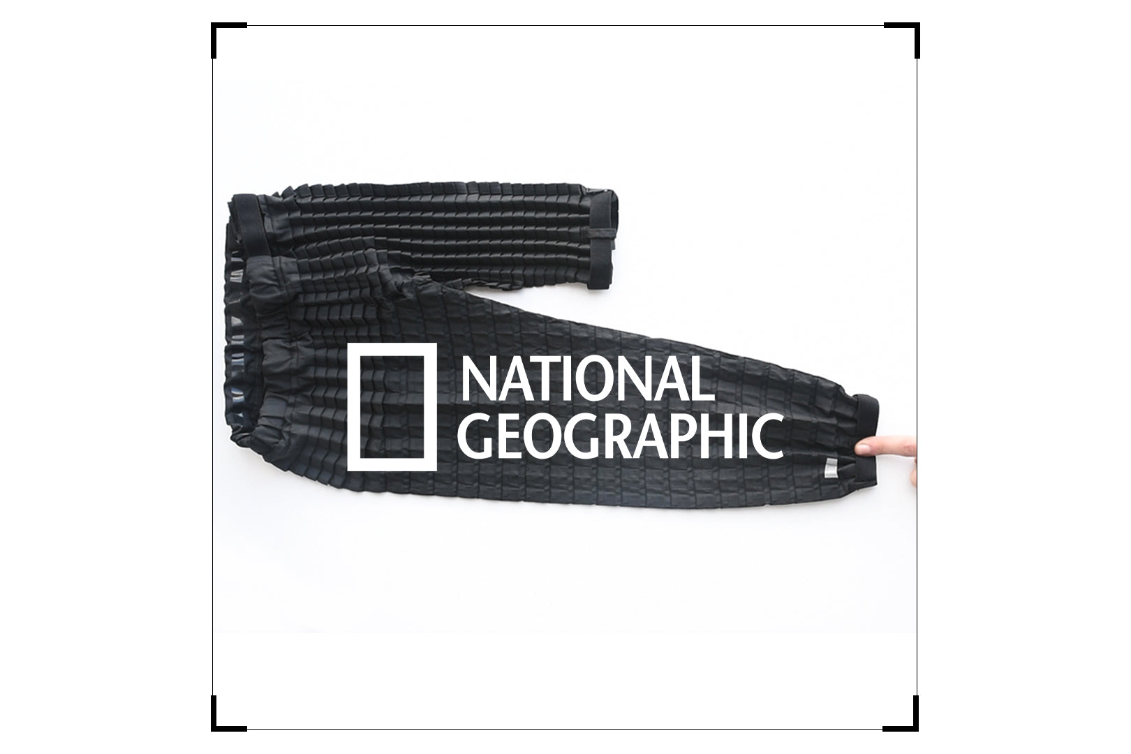 Stretched pair of Petit Pli's Versatile Bottoms with National Geographic overlay