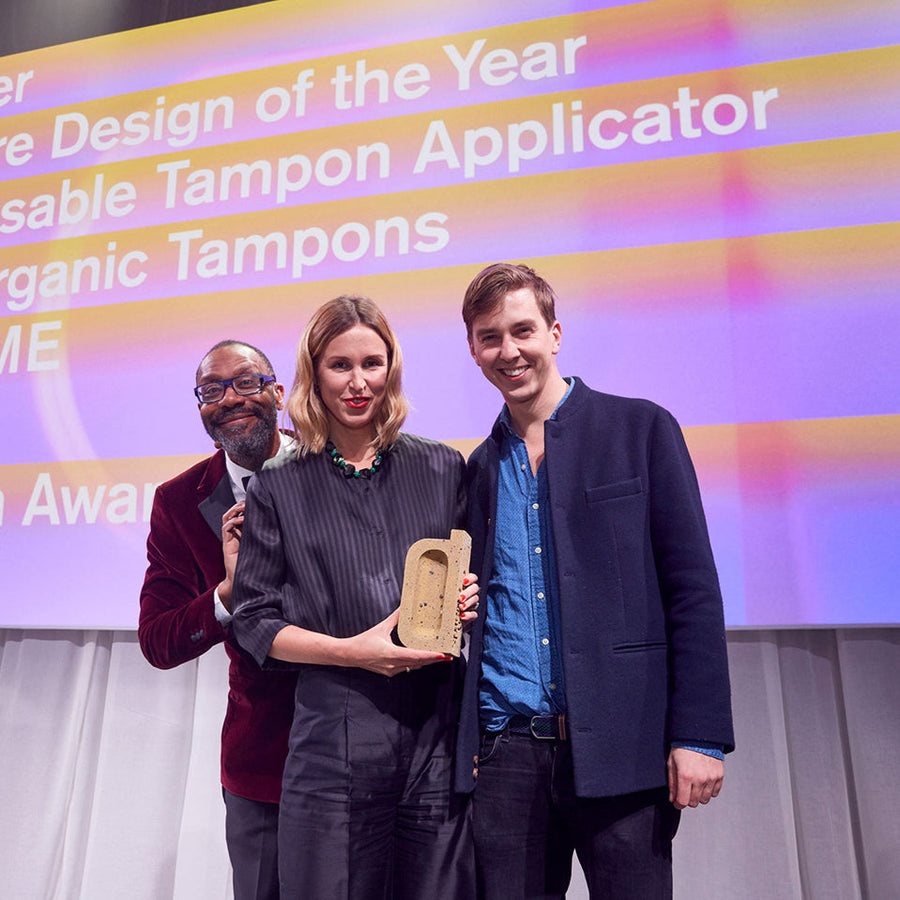 DAME co-founders accept the Beazley Design of the Year award for their reusable tampon applicator, celebrating sustainable innovation in London.