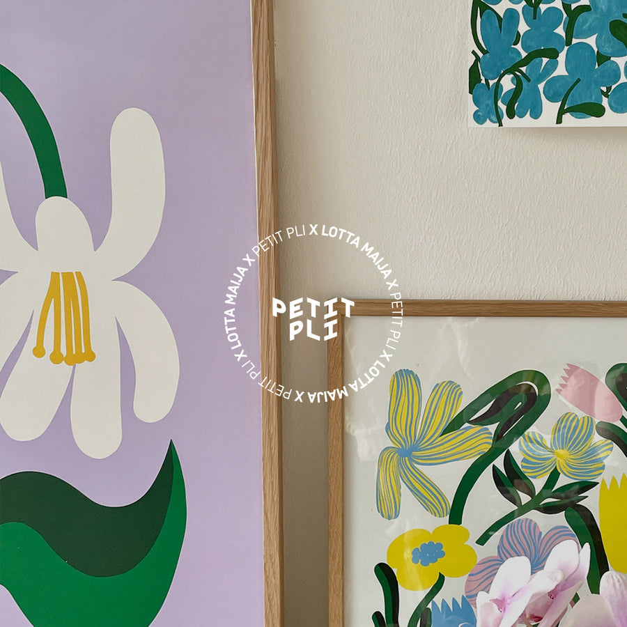 Framed floral artworks from Petit Pli x Lotta Maija, featuring bold fruit and flower illustrations in bright, whimsical colours and organic shapes.