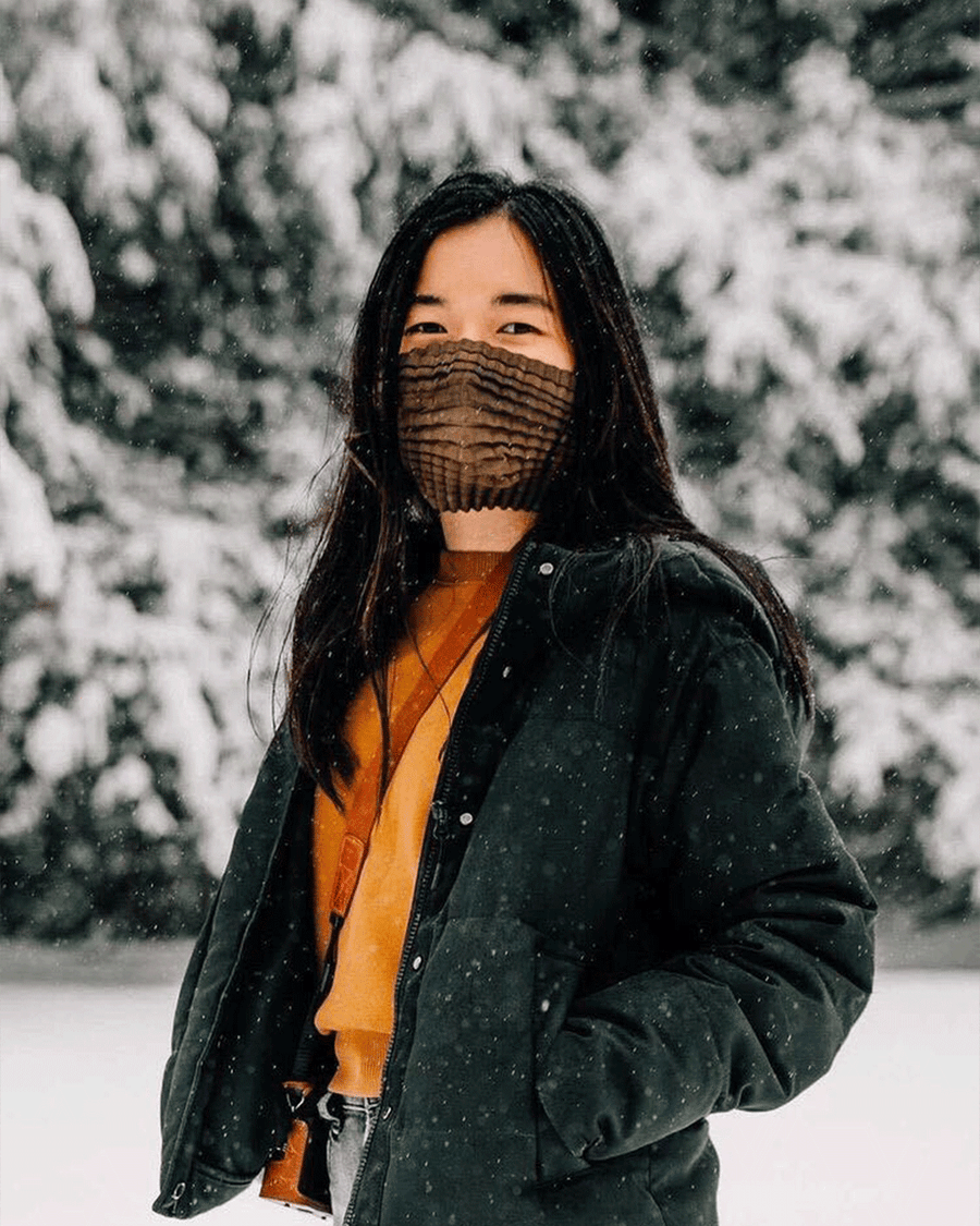 Photo of Grace wearing Petit Pli's MSK against the snowy backdrop of Virginia, USA